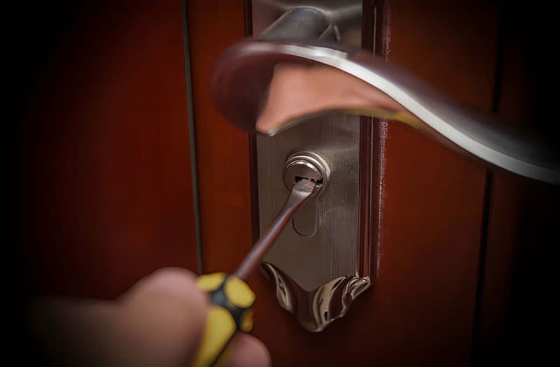 Locksmith working at a door