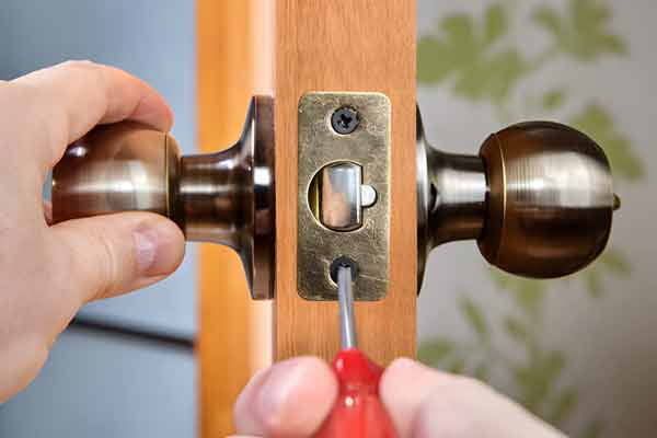 Close-up of door lock hardware and keys
