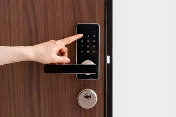 Finger operating a keypad smart lock